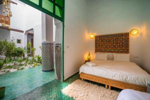 a bedroom with a bed and a glass floor at Riad Old City Palace in Fez +174 photos