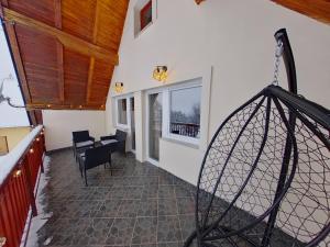 a view of a room with a table and chairs at Cavljak Retreat, Sarajevo in Barice