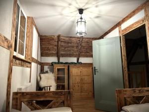 a room with a ceiling fan and wooden walls at Leśny Sentyment na Gwizdówce na Kaszubach in Załakowo +35 photos