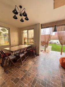 a dining room with a table and chairs at Villa “Eleon” in Velyka Bihanʼ