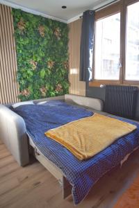 Ένα ή περισσότερα κρεβάτια σε δωμάτιο στο Le Cube Alpin - Cosy Studio - Vue Montagne - Gréolières les Neiges