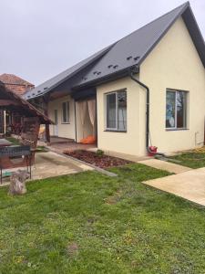 a house with a solar roof on top of it at Villa “Eleon” in Velyka Bihanʼ