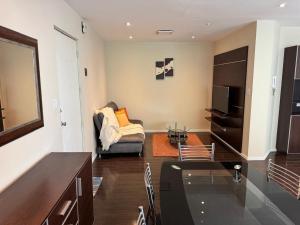 a living room with a couch and a table at 7th floor Live, Laugh and Relax in Cochabamba +10 photos