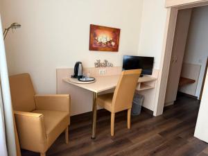 TV a/nebo společenská místnost v ubytování M&M Hotel - Seevetal