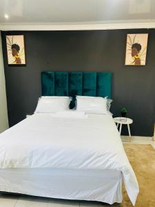 Postel nebo postele na pokoji v ubytování Sunset guest house