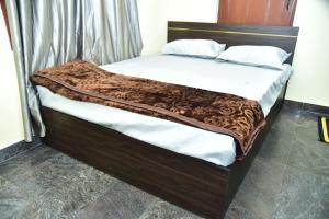 Ένα ή περισσότερα κρεβάτια σε δωμάτιο στο Anichethana