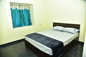 Ένα ή περισσότερα κρεβάτια σε δωμάτιο στο Anichethana