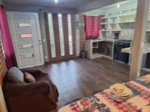 a living room with a couch and a kitchen at departamento 2 en condominio in Amecameca de Juárez +19 photos