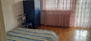 a small bedroom with a bed and a window at Chambre in Schiltigheim