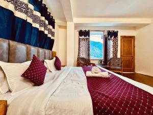 Ένα ή περισσότερα κρεβάτια σε δωμάτιο στο Royal Majestic Mount View Cottage