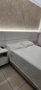 En eller flere senge i et værelse på Piscina com Hidro Perto da Praia Poucas datas disponíveis + 40 billeder