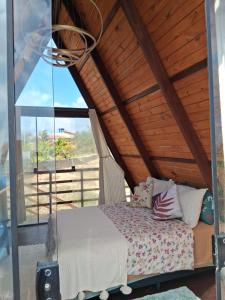 Ένα ή περισσότερα κρεβάτια σε δωμάτιο στο Paraiso