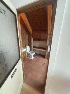 a small bathroom with a toilet in a room at Shatemuc, a magical getaway on the Hudson River in Kingston +90 photos