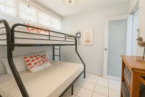 Ένα ή περισσότερα κρεβάτια σε δωμάτιο στο Tropical Tranquility - Corcega