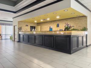 a lobby of a hospital with a reception counter at Havelock Hotel in Havelock