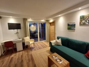 Μια τηλεόραση ή/και κέντρο ψυχαγωγίας στο Ferienwohnung Mader