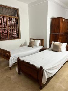 Ένα ή περισσότερα κρεβάτια σε δωμάτιο στο Velora Villa Tangalle