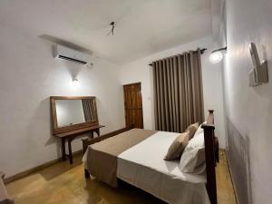 Ένα ή περισσότερα κρεβάτια σε δωμάτιο στο Velora Villa Tangalle