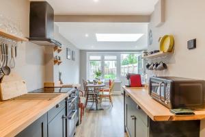 a kitchen with a counter top with a microwave at 2 Bed in Pakefield oc-p32922 in Lowestoft