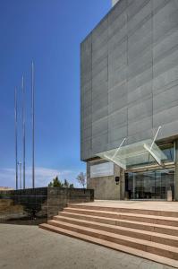 a building with some stairs in front of it at Sercotel Ciutat de Montcada in Montcada i Reixac +38 photos