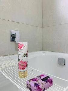 a empty refrigerator with a box on the shelf at 2 Bed 2 Bath Private Garden Apartment in Fourways +22 photos