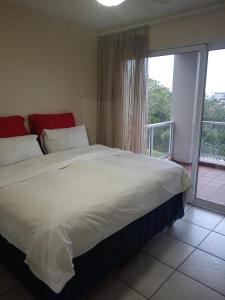 Ένα ή περισσότερα κρεβάτια σε δωμάτιο στο Shelly Beach Guest house