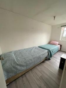 Ένα ή περισσότερα κρεβάτια σε δωμάτιο στο House in Puerto Varas per day