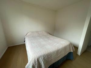 Ένα ή περισσότερα κρεβάτια σε δωμάτιο στο House in Puerto Varas per day +1 φωτογραφίες