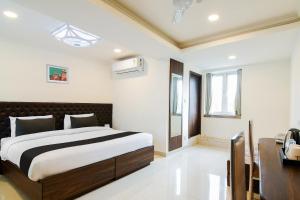 Postel nebo postele na pokoji v ubytování Super Hotel O by OYO Eminent Hotel