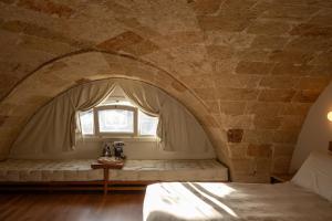 Кровать или кровати в номере Monteforte Suite & Spa