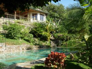 a house with a swimming pool in a yard at Rangala House in Digana