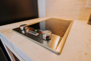 a stove top on a counter in a kitchen at 605 Tower Downtown Cabo in Cabo San Lucas +182 photos