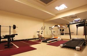 a gym with weights and equipment in a room at Hotel Skypark Jeju 1 in Jeju