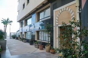 a building with plants on the side of it at LUXURY DOWNTOWN BEACH Apartment 2 Bedroom in Tangier +2 photos