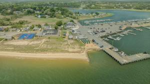 an aerial view of a marina with boats in the water at Private Downtown Wellfleet Location in Wellfleet
