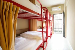 A bunk bed or bunk beds in a room at D Hostel Bangkok