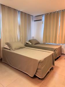 Ένα ή περισσότερα κρεβάτια σε δωμάτιο στο Hotel Mais Lazer +17 φωτογραφίες