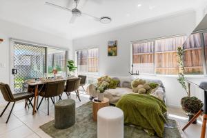 a living room with a couch and a table at Comfy Home in Deebing Heights in Loamside