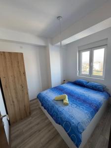 Ένα ή περισσότερα κρεβάτια σε δωμάτιο στο Apartman Mila