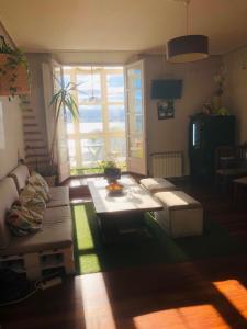 a living room with a couch and a table at Hostel Santander in Santander