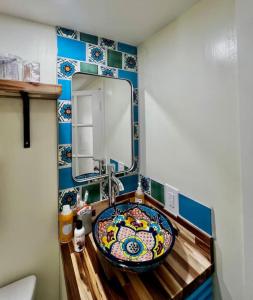 a bathroom with a sink and a mirror at Mid-century marvelous 1 bed, pets welcome in Las Cruces