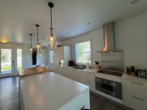 a kitchen with a counter top in a room at Honeysuckle Beach Oasis at Veranda Beach in Oroville