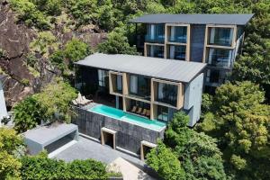 an aerial view of a house with a swimming pool at Barad Lux Villa in Mae Haad