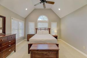 a bedroom with a bed and a ceiling fan at The Landing at Wheat St. 2Br in Columbia