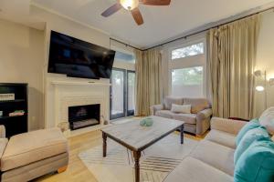 a living room with a table and a fireplace at The Landing at Wheat St. 2Br in Columbia