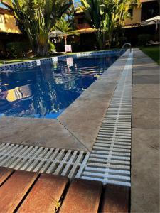 uma piscina com um ralo no meio em Suíte Beleza do amor V11 A em Pipa