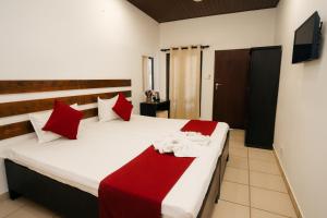 Giường trong phòng chung tại Ayurna Ayurveda Resort And Spa