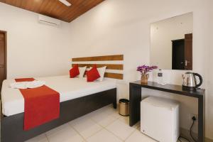 Giường trong phòng chung tại Ayurna Ayurveda Resort And Spa