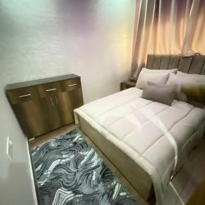 a bedroom with a bed with a zebra patterned carpet at Prime stay downtown Meknes in Meknès