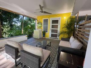 a patio with couches and a table at The Spot at Rincon in Rincon